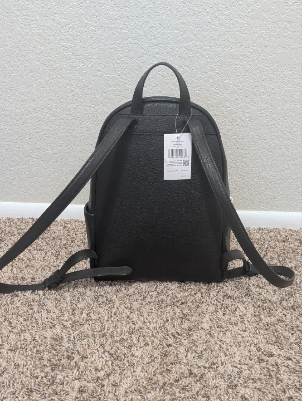 Kate Spade Leila black pebbled leather medium dome backpack with gold hardware